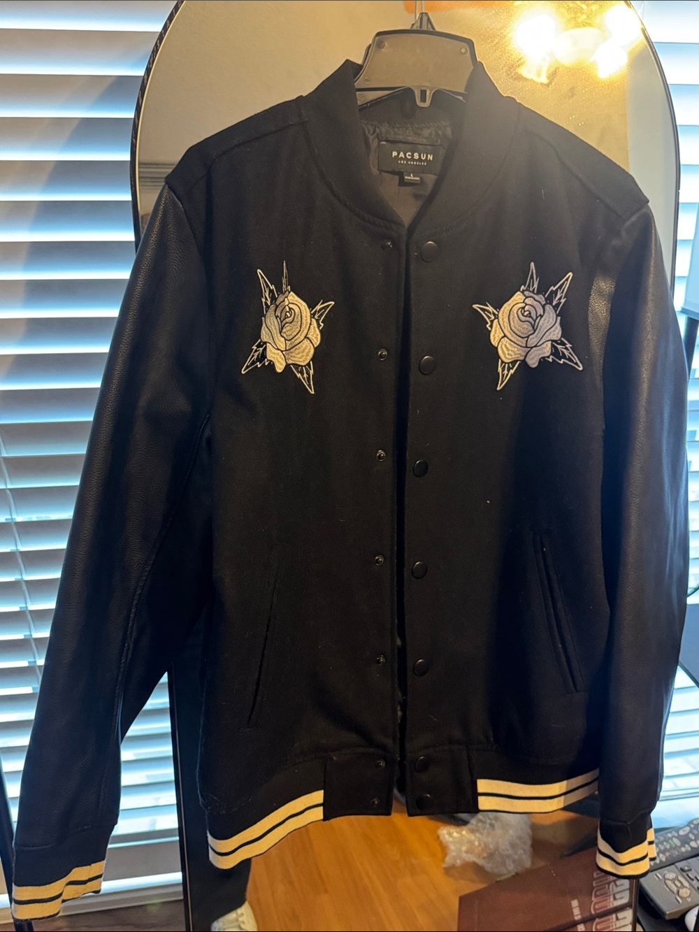 PacSun Black Varsity Jacket with Cream Stripe Trim and White Rose Patches